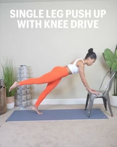 a woman in an orange and white top is doing yoga