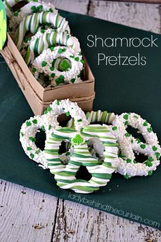 green and white pretzels sitting on top of a table next to a cardboard box