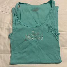 Brand New “ Just Married “ Tiffany Blue In Color Tank Top ! Never Worn Or Tried On. Accidentally Purchased This And Realized It Won’t Fit As I Wear A Medium/ Large Lol . Oh Well Lol ! Hoping Someone Else Can Wear This Cute And Simple Tank For That New Bride Or Bride To Be ! And Congratulations To You In Advance ! All Of The Rhinestones Are Intact, And There Are No Holes Or Ripping Or Tears At All ! Victoria's Secret Blue Sleeveless Top, New Bride, Congratulations To You, Oh Well, Bride To Be, Tiffany Blue, Just Married, Women's Intimates, Victoria's Secret