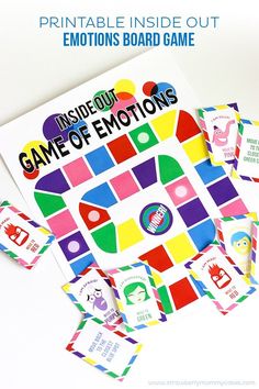 the inside out game of emotions is displayed on a white surface with colorful stickers