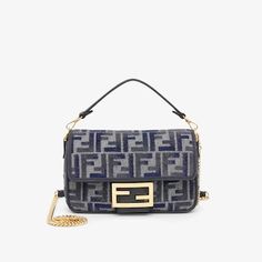 Small, iconic Baguette bag made of chenille with the iconic FF motif in dark blue gradient tones, embellished with dark blue calfskin trim and decorated with an FF clasp. Featuring a front flap, magnetic clasp, one grey fabric-lined internal compartment with a calfskin pocket and gold-finish metalware. The bag can be carried by hand or worn either on the shoulder or cross-body thanks to the calfskin handle and chain shoulder strap, both detachable. Holds a 6.7-inch smartphone, Mini Trifold card Fendi Baguette Mini, Fendi Baguette, Baguette Bag, Boston Bag, Ski Wear, Grey Fabric, Belt Bag, Baguette, Bag Making