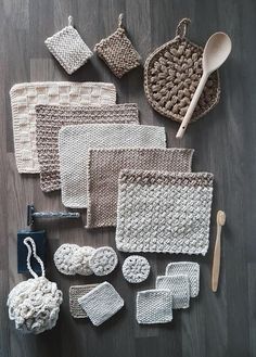 crocheted items are laid out on the floor