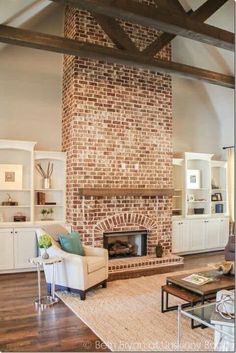 a living room filled with furniture and a fire place