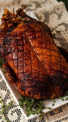 a piece of meat sitting on top of a white plate