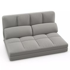 a gray couch with pillows on top of it