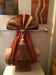 a towel rack with two towels hanging on it