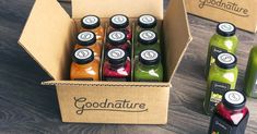 a box filled with different types of juices and condiments on a table