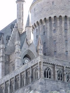 an old castle with a clock on the front