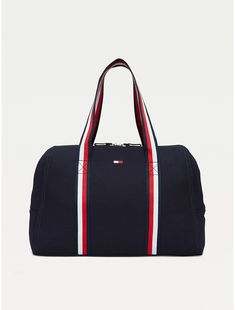 Tommy Hilfiger women's bag. Practicality and standout style come together in this spacious zip tote, showcasing our signature stripes at the handles for a branded finish.  Material: 100% Cotton. Sporty Rectangular Canvas Bag, Sporty Rectangular Cotton Bag, Sporty Canvas Bags For On-the-go, Sporty Canvas Gym Bag, Navy Sporty Bag With Zipper Closure, Sporty Navy Bag With Zipper Closure, Sporty Canvas Bag With Zipper Closure, Sporty Cotton Bags For Daily Use, Everyday Tommy Hilfiger Bag With Zipper Closure