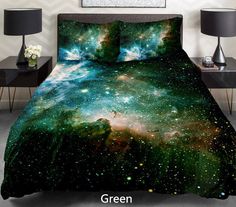 a bed covered in a blue and purple galaxy comforter