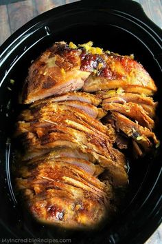 sliced meat in a slow cooker on a table