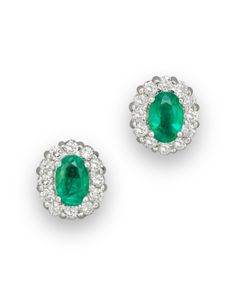 Emerald and diamond oval stud earrings in 14K white gold. Luxury White Gold Oval Diamond Earrings, Luxury Oval White Gold Diamond Earrings, Exquisite Oval Diamond Earrings With Accents, Formal Oval Diamond Earrings With Gemstones, Oval Diamond Earrings Fine Jewelry, Exquisite Oval Diamond Earrings For Anniversary, Formal Oval Earrings With Diamond Accents, Elegant Oval Earrings With Pave Setting, Oval Diamond Earrings In Pave Setting