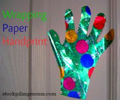 a hand made out of paper with the words wrapping paper and pom - poms