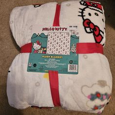 the hello kitty blanket is wrapped in white