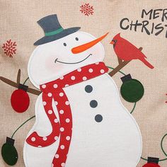 a snowman with a red scarf and hat on it's head is standing in front of a christmas card