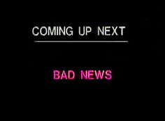 the words coming up next are shown in pink neon letters on a black background,