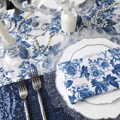 a blue and white place setting with silverware