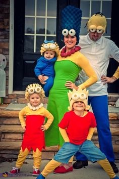 the family is dressed up in costumes for halloween