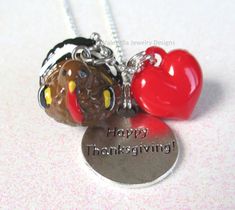 This Totally cute 3D Thanksgiving Turkey charm necklace is all the joy of Thanksgiving with none of the calories! This super sparkly necklace is made with the finest supplies including: 3D resin turkey charm, red heart charm, "Happy Thanksgiving" antiqued silver round charm,  18 inch silver plated ballchain necklace. To see more from my shop click here: Heysista.etsy.com Thanks for looking! Thanksgiving Necklace, Turkey Necklace, Sacred Geometry Jewelry, Thanksgiving Jewelry, Molecule Necklace, Sparkly Necklace, Engraved Crystal, Boho Pendant, Thanksgiving Gift