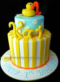 a birthday cake with a rubber ducky on top