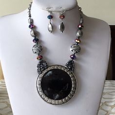 Shop joe37s's closet or find the perfect look from millions of stylists. Fast shipping and buyer protection. Black and silver/ circle pendant 70mm/ faceted glass bead/ silver tone bead/ lead and nickel free/ necklace with matching earring/ 16” long with a 3”extension. Silver Beaded Round Jewelry Sets, Silver Beaded Jewelry Sets, Black Metal Beaded Necklace With Silver Beads, Black Beaded Necklace With Silver Beads, Silver Round Beaded Metal Necklace, Silver Metal Jewelry With Black Beads, Bohemian Silver Jewelry With Black Beads, Circle Pendant Necklace, Silver Circle