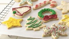 decorated christmas cookies on a baking sheet ready to be baked in the oven or used as decorations