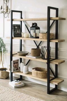 a book shelf with baskets and other items on top of it in a living room