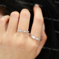 a woman's hand with a diamond ring on her left hand and the word love written in it