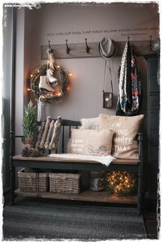 a bench with pillows and christmas decorations on it