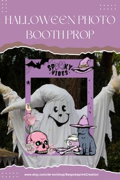 a halloween photo booth with a ghost and two cats in the frame, on top of a purple background