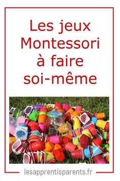 a pile of plastic cups sitting on top of a grass covered field with the words les jeux montessori a fair soi meme