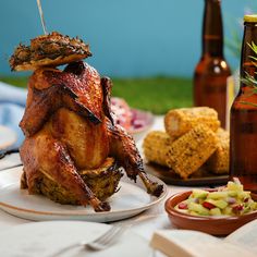 a whole chicken sitting on top of a white plate