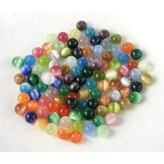 multicolored glass marbles on white background