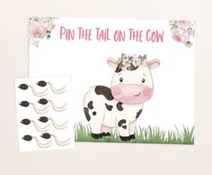 a card with a cow and some flowers on it's head, next to an envelope that says pin the tail on the cow