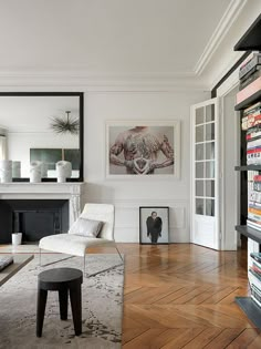 a living room filled with furniture and a fire place