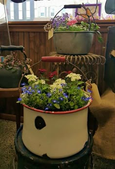 a potted plant sitting on top of a table next to a bike and umbrella