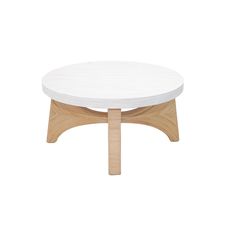 a white coffee table with wooden legs and a round top, on a white background