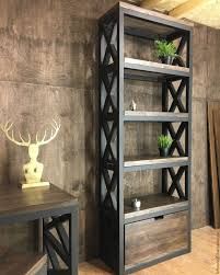 a wooden shelf sitting next to a table with two plants on it and a deer head