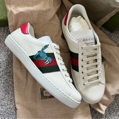 New With Box And Dust Bags Size Gucci Men 7.5=Us8=Eu41.5 Gucci White Calf Leather Sneakers, White Gucci Sneakers In Calf Leather, White Gucci Calf Leather Sneakers, Gucci Calf Leather Sneakers, Gucci Luxury Custom Sneakers With Rubber Sole, Luxury Gucci Sneakers With Rubber Sole, Luxury Leather Sneakers With Embroidered Logo, Luxury Leather Custom Sneakers With Embroidered Logo, Designer Leather Custom Sneakers With Embroidered Logo