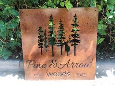 a metal sign that says pine and arrow woods