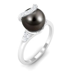 Product Details A classic piece with timeless appeal this Pearl Solitaire Engagement Ring is adorned with the brilliant Round Shape Tahitian Pearl with Round Diamond set on Trio and on above the pearl. This Tahitian Pearl Ring is crafted in Gold. This charming Black Tahitian Pearl and Diamond Ring makes for a trendy and elegant choice for your big day. Product Information SKU SHP-RINGS072210080 Weight 2.32 gm (Approximate) TAHITIAN PEARL INFORMATION No.of Stones 1 Pieces Total Weight 8.09 Carat Tahitian Pearl Ring, Round Diamond Setting, Tahitian Black Pearls, Pearl And Diamond Ring, Tahitian Pearls, Signature Jewelry, 18k Yellow Gold Ring, Timeless Jewelry, Black Pearl