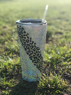 the tumbler cup is decorated with leopard print