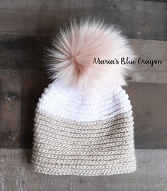 a white knitted hat with a pink pom - pom on top and the words free crochet pattern faux knit hat