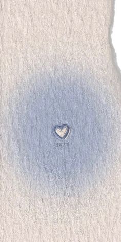 a heart shaped hole in the middle of a white paper with blue ink on it