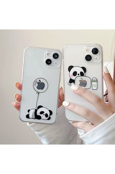 a woman holding up two cell phones with pandas on the back and an apple phone case