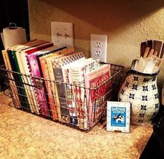 a basket filled with books sitting on top of a counter