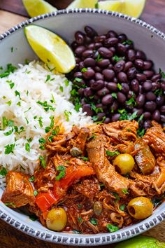 a close up of a bowl of food with beans and rice