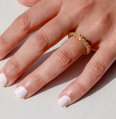 Introducing the adorable Halo Ring, your new favorite accessory that's as charming as it is chic! This darling minimalist layering ring is like a tiny treasure for your fingers, with its dainty design and 18K Gold Plated Chunky Statement style that adds just the right amount of sparkle to any look. Say hello to whimsy with its irregular shape, giving it a playful edge that's sure to catch eyes and hearts alike. Bold yet sweet, this ring is your go-to fashion sidekick, ready to make every outfit pop with its trendy flair. But wait, there's more! The Halo Ring is not just a pretty face - it's also waterproof and tarnish-free, meaning it can keep up with all your adventures without losing its shine. So whether you're splashing in puddles or dancing in the rain, this ring has got you covered! Trendy Yellow Gold Stackable Rings For Everyday, Trendy Yellow Gold Midi Rings For Everyday, Trendy Everyday Yellow Gold Midi Rings, Trendy Tarnish-resistant Yellow Gold Stackable Rings, Trendy Hypoallergenic Midi Rings For Everyday, Trendy Everyday Toe Rings, Trendy Hypoallergenic Midi Rings, Trendy Everyday Hypoallergenic Midi Rings, Handmade Stackable Rings For Everyday Wear