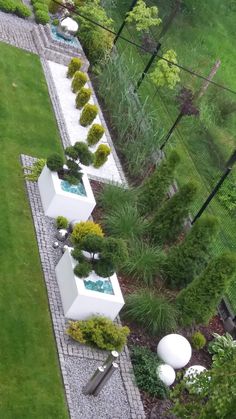 an aerial view of a garden with trees and shrubs