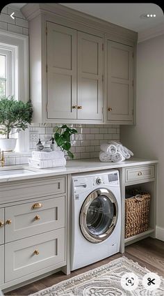 a washer and dryer in a small room